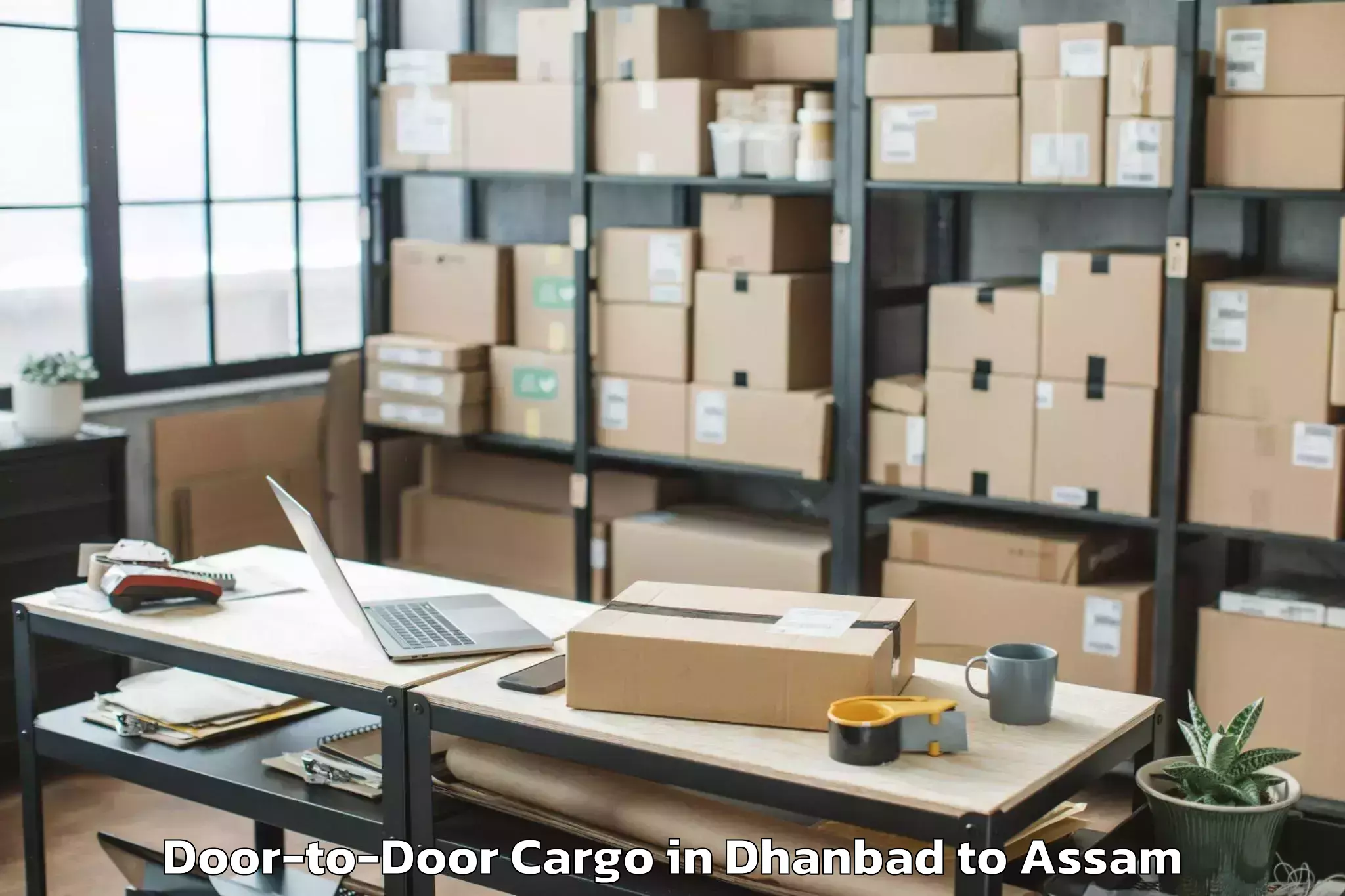 Easy Dhanbad to Pandu Door To Door Cargo Booking